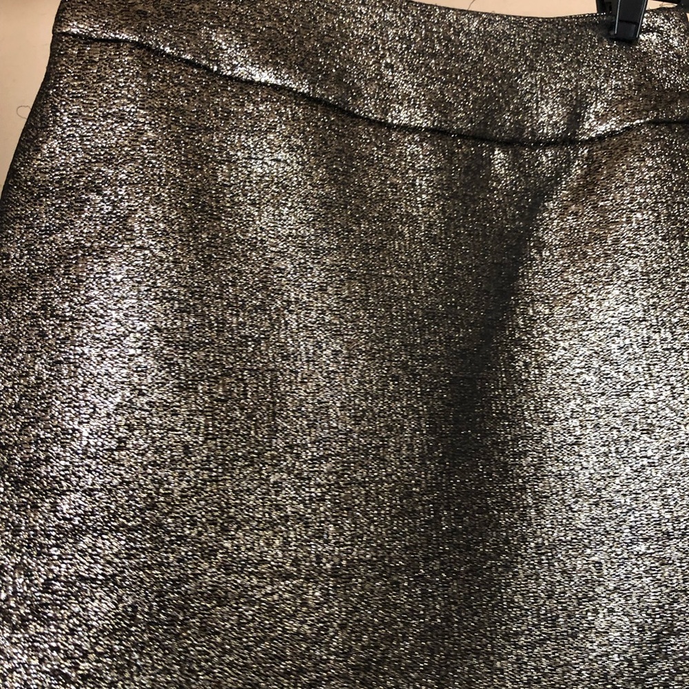 Gold and black mini skirt.